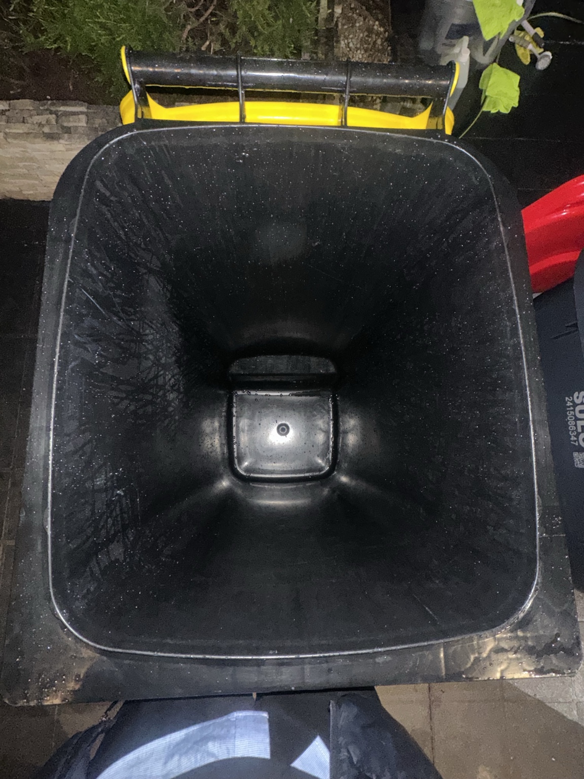Clean interior of a yellow-lid recycling bin