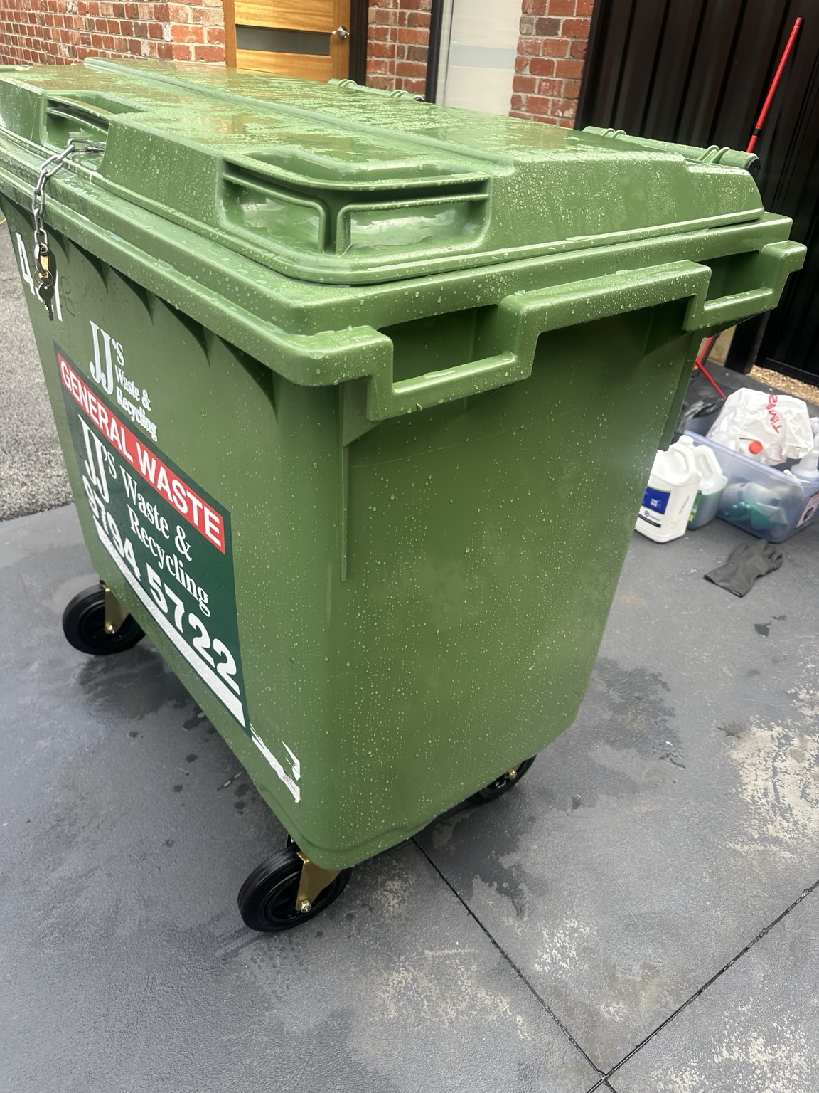 Freshly cleaned wheeled commercial waste bin